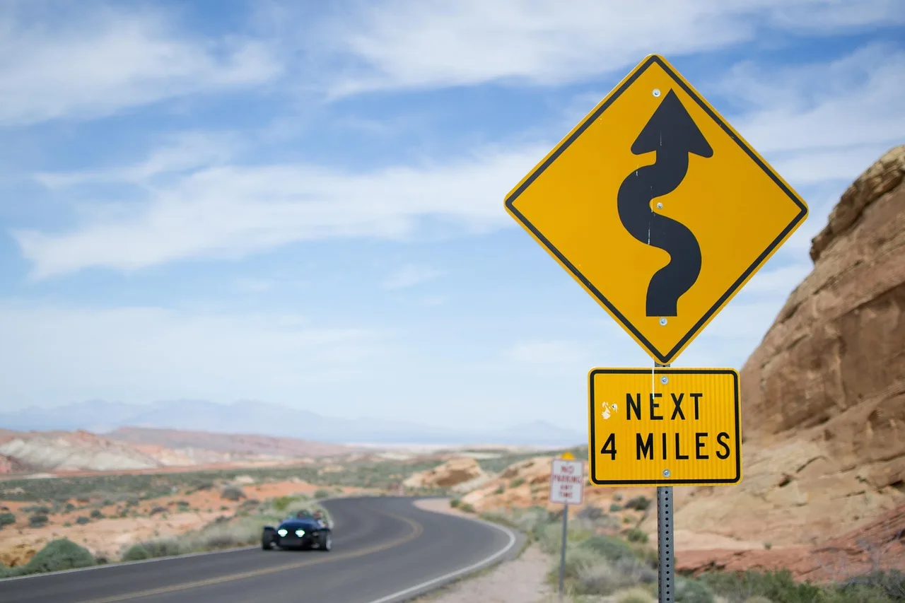 valley of fire, nature, usa, nevada, america, desert, rock, road, landscape, asphalt, sign, curves, heaven, road trip, ride, country road, distance, street sign, traffic sign, attention, to travel, danger, traffic, caution, prudently. Slow road travel accessible options: two BLM byway examples