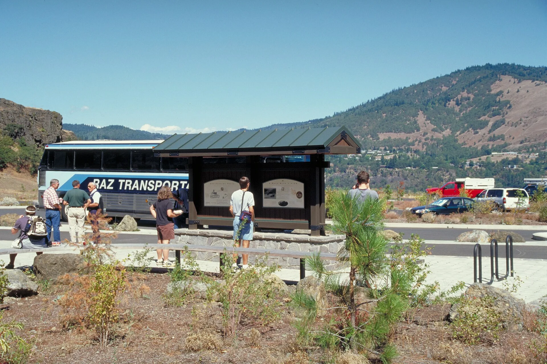 Scope and content: The original finding aid described this photograph as: Original Caption: A tour group wander outside the Mark O. Hatfield West Trailhead and Visitor Center. Location: Location: Oregon (45.654° N 121.211° W) Status: Public domain. Photo by Dennis Adams of FHWA. How to compare guided tours on historic highways by the interpretation they include