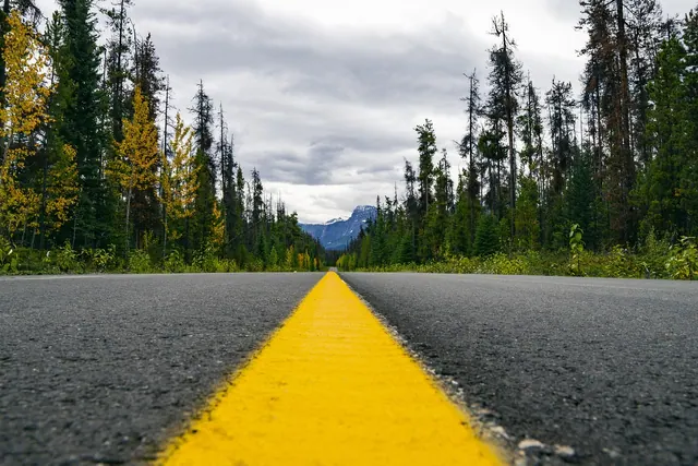highway, wilderness, yellow line, asphalt, landscape, travel, road, forest, mountains, woods, discover, outdoors, nature, journey, adventure, summer, explore, sky, scenic, route, d