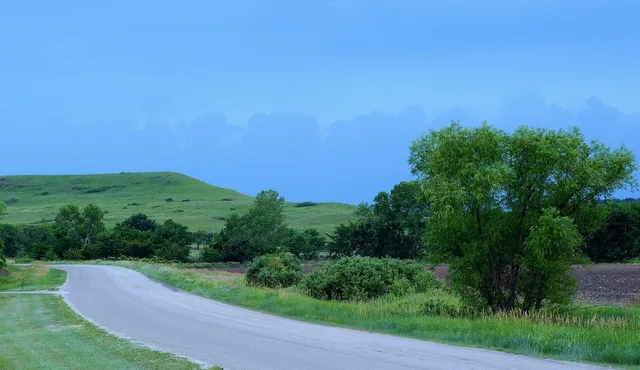 scenic, byway, country road, kansas, hills, storm, clouds, country, nature, gravel, spring, trees, green, blue storm. How the National Scenic Byways Program reshapes your US road trip route