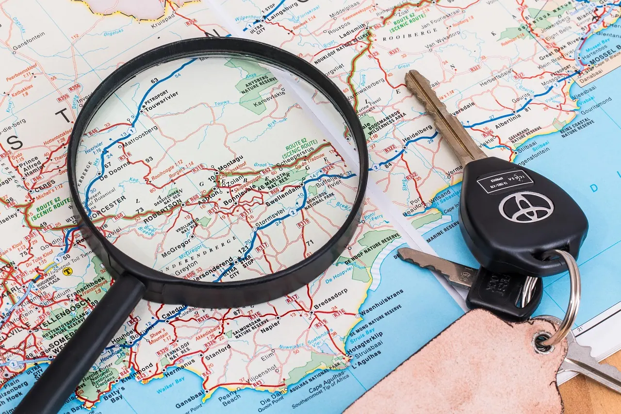 map, vacation, travel, driving, holiday, car keys, magnifying glass, trip, summer, journey, tourism, nature, adventure, leisure, tourist, road, drive, transport, route, way, street. How to Plan a Slow Road Trip on the Lincoln Highway Without Missing the Old Alignments