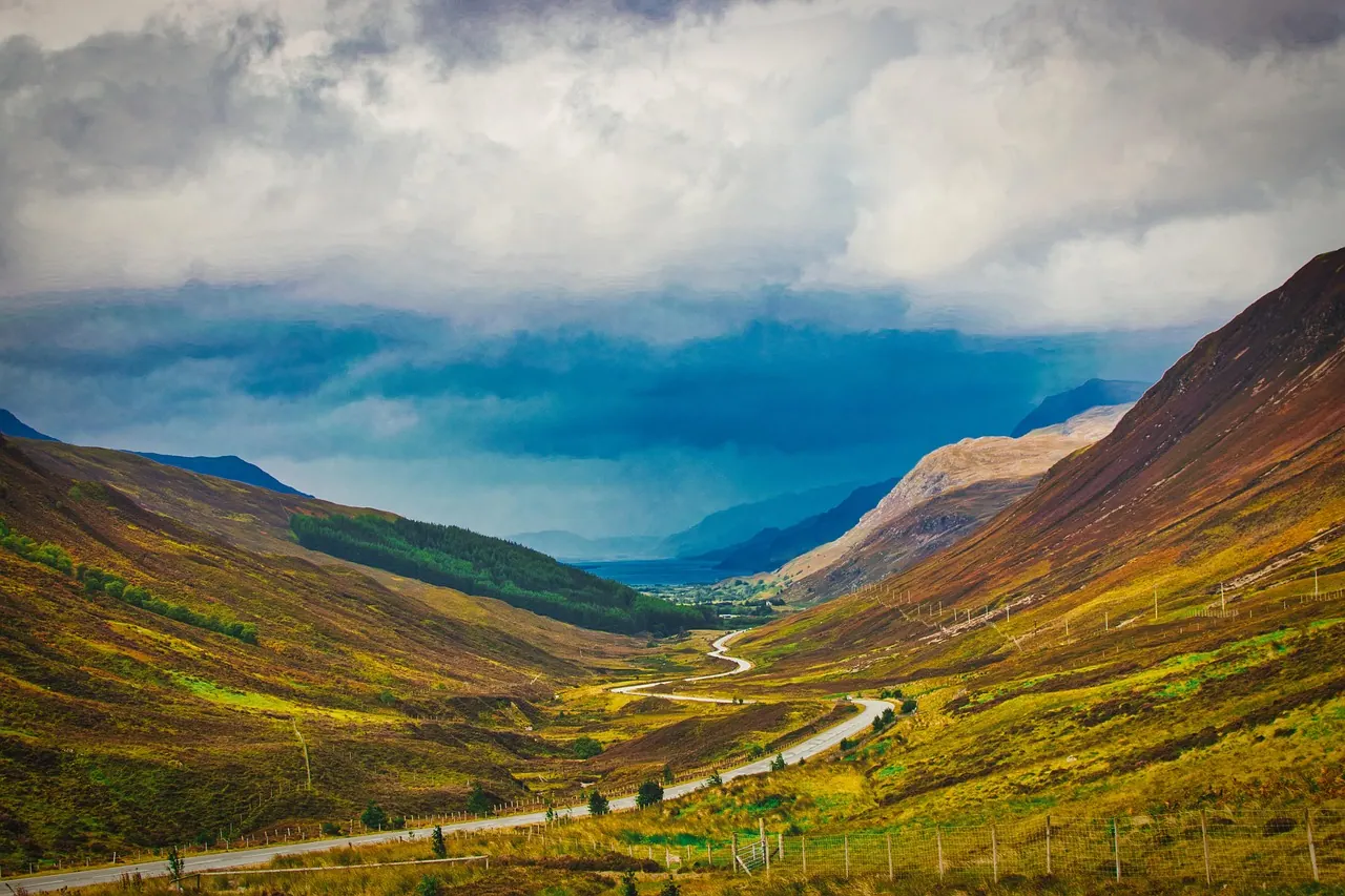scotland, valley, nature, hill, country road, road, clouds, to travel, landscape, scenic, travel, scene, rural. What slow travel mistakes cost: transport, stays and tickets