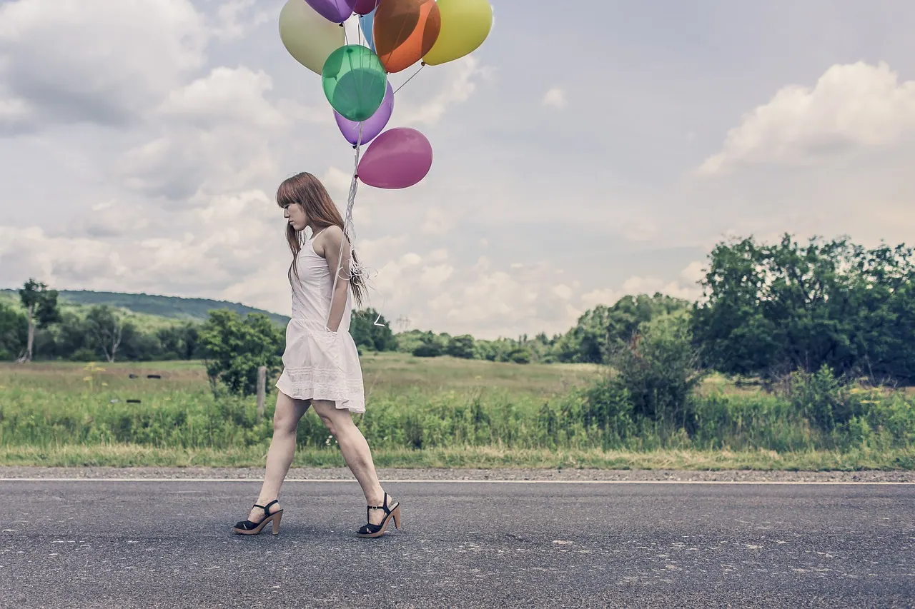 balloons, girl, walking, street, celebration, bunch, colors, woman, high heels, dress, legs, redhead, hair, country, happy birthday, road, nature, grass, fields, trees